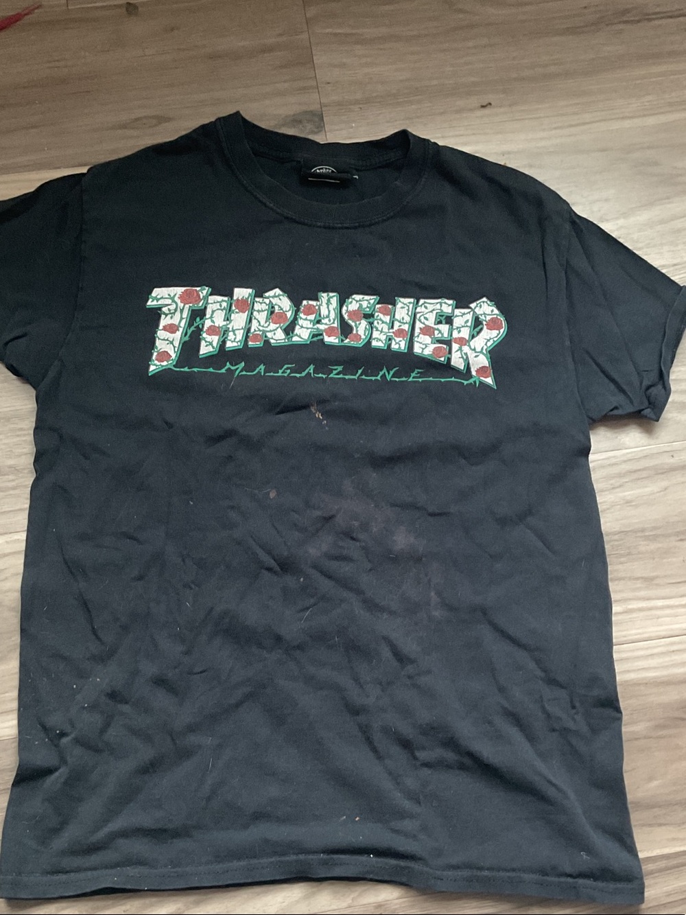 Thrasher Black Tee with Green and Red Floral Logo